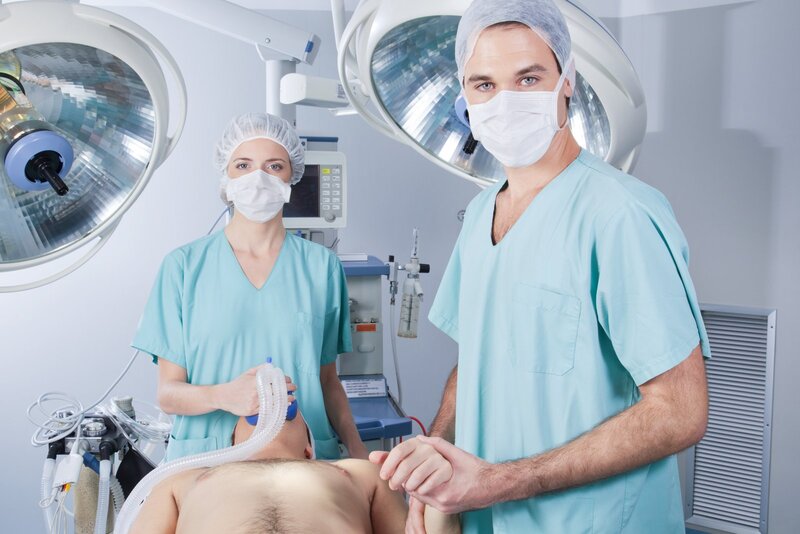 three people in the operating room